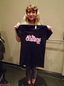 An artist from the Comic Book School classes shows off her Girls Like Comics Too shirt. 